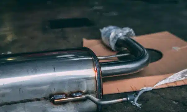 stainless steel tube on gray textile