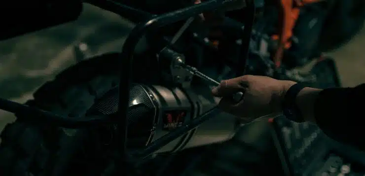 a close up of a person working on a motorcycle